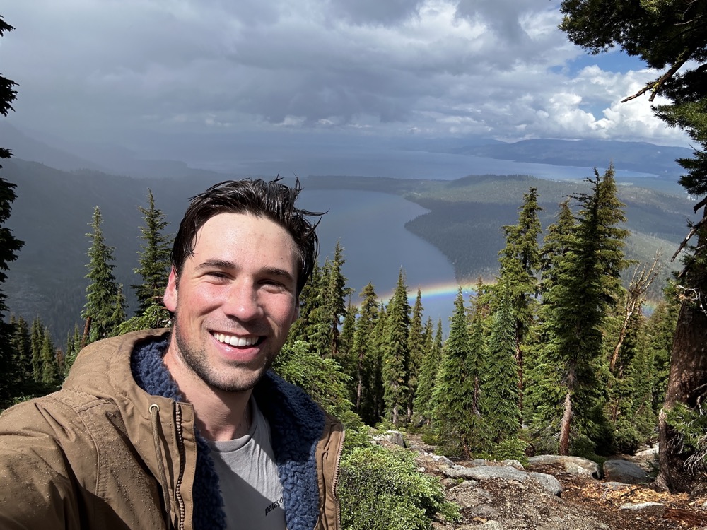 Calvin Laughlin overlooking a mountain lake after a storm